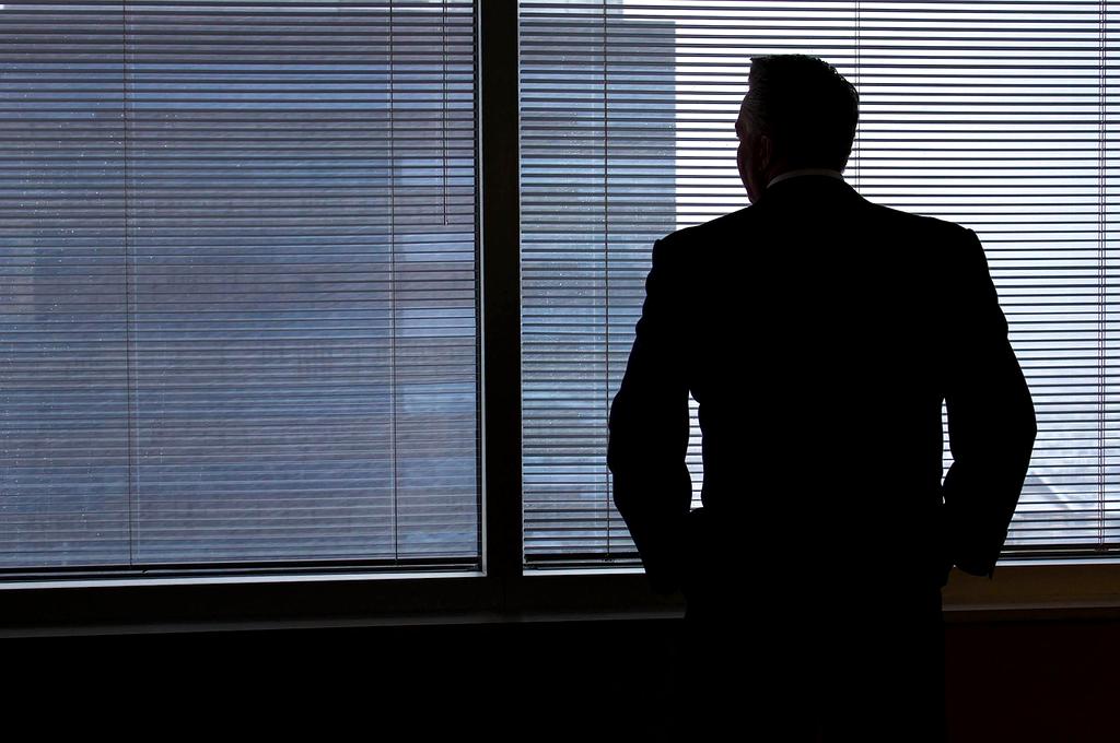 Executive leadership coaching session in modern office boardroom